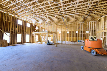 Wooden beams framework construction is under way for construction of new house