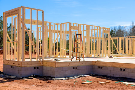 During construction of new house, wood stick frame is used to frame beams