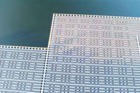 Solar panels float on a lake water during environmentally friendly generation of electricity
