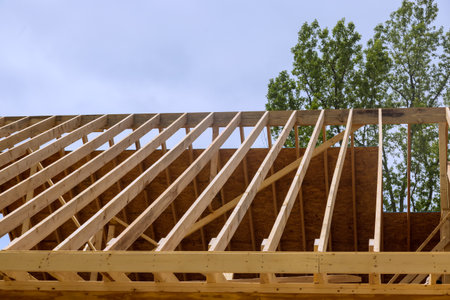 Timber wooden truss frame beam house stick built home under framework construction new buildの写真素材
