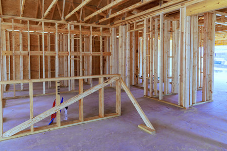 Timber wood stick frames framing beams during construction of new home