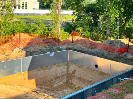 Currently, steel structures are being constructed near house for construction of swimming poolの写真素材
