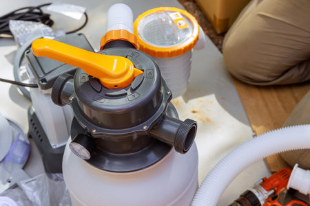 Assembling sand filter system tank using equipment that is used to clean pools swimming pool