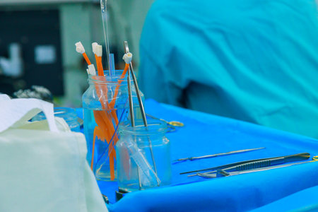 Preparation of sterile surgical instruments during an operation in hospital operating room.