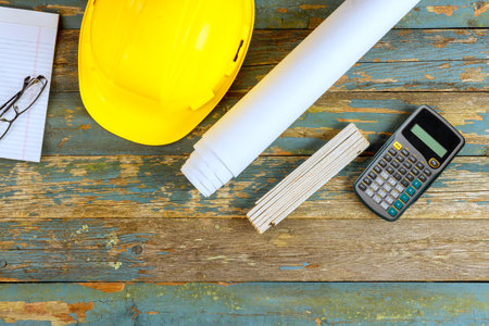 In celebration of Labor Day, safety gear helmet is displayed against rustic wooden backdrop at United States of Americaの写真素材