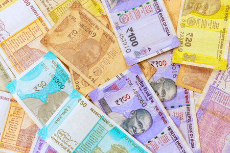 Cash with Indian rupees in various denominations of currency banknotes for business investments economic developmentの写真素材