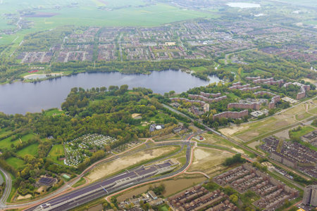 This is an aerial view of city Amsterdam, Netherlands in cloudy weatherの写真素材