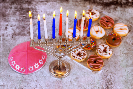 Hanukkah Jewish celebration, where light tradition are combined to fill homes with warmth joy with nine lit candles in menorahの写真素材