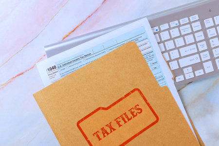 1040 tax form file computer keyboard on workspace suggest preparation for tax season financial...