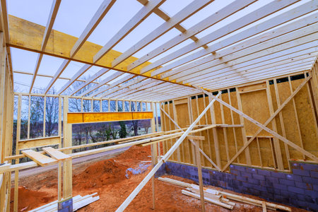Construction are building wooden beams frame in rural setting, under works day