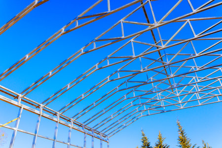 Metal frame structure is being built under warehouse ongoing construction process.の写真素材