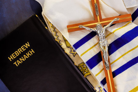 24 April 2025 Jerusalem Israel Hebrew Tanakh, a crucifix, tallit are arranged together, symbolizing...