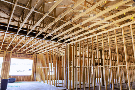 Workers are building new interior with visible wooden framing ceiling supports in works dayの写真素材