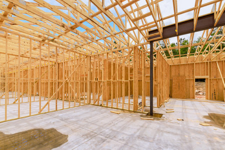 Wooden framing is being installed beams in new residential construction project under work dayの写真素材
