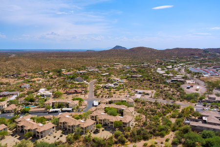 Mirage Cove Condominiums in Fountain Hills, Arizona residential development features tan colored buildings with parking areas surrounding Sonoran desert landscapeの写真素材