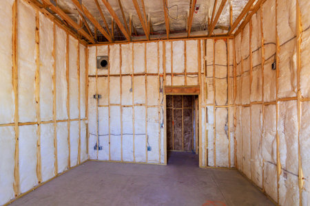 An unfinished room insulation material set for drywall installation, ready for further construction steps.の写真素材