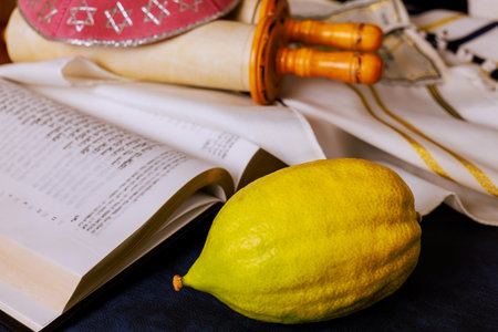 Jewish festival of Sukkot traditional symbols yellow etrog is an Hebrew Holy prayer book