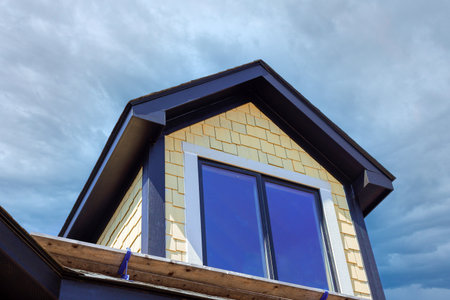 Newly built house showcases modern architecture with large windows unique roof design against