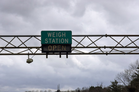 Weigh station sign shows it is open, located on American highwayの写真素材