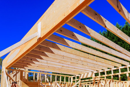 Wooden rafters are being installed for new home under residential area.
