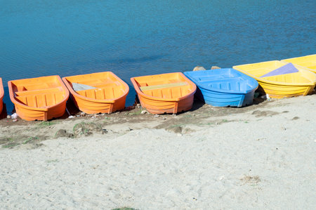 Colorful boats on the shore of the lake, closeup of photoの写真素材