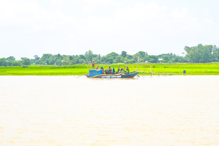 Fisherman boat on the Mekong River. The Mekong River is a freshwater river in Southeast Asia.