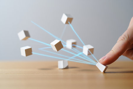 Conceptual digital network with cubes. Hand pushing one block. Technology connection.の素材