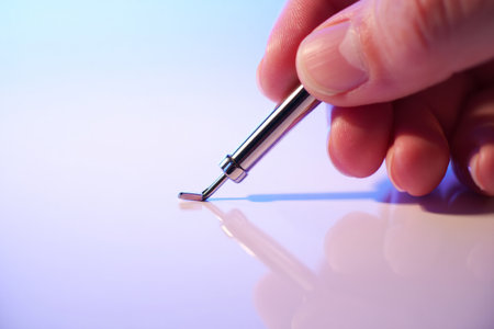Person holds dental instrument. Clinic care needs precision delicacyの素材
