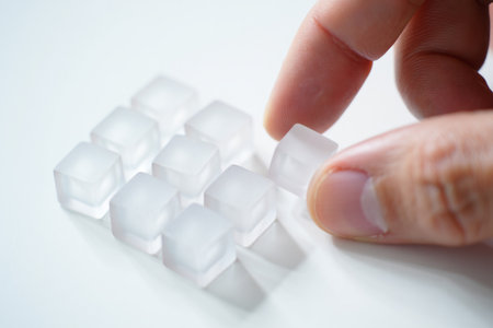 Creating order acrylic cubes. Grid pattern arrangement on white.の素材