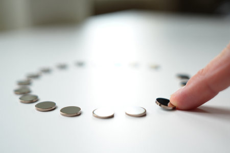 Metallic discs arranged. Circular pattern. Unity and connection idea.の素材