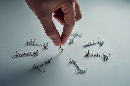 Connecting nails idea. Leadership networking teamwork and relationships.の素材