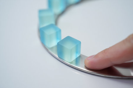 Finger touches translucent cubes. Modern aesthetic and order.の素材