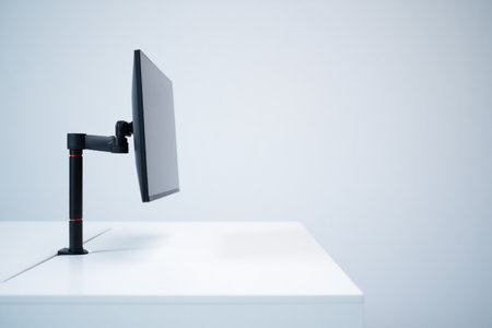 Work space with monitor arm. Desktop mount and modern office desk.の素材