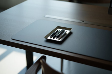 Work table desk mat with pens. Stationery accessories workplace planning.の素材