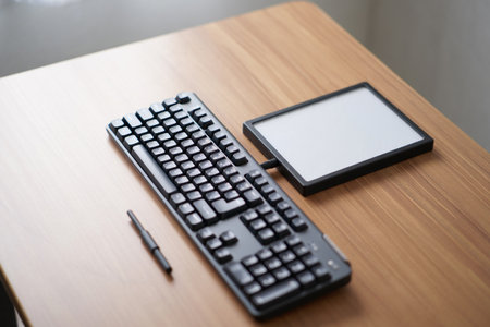 Keyboard tablet stylus. Minimalist workspace setup. Technology business.の素材