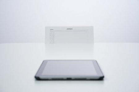 Electronic communication. Minimalistic workspace. Digital tablet device.の素材