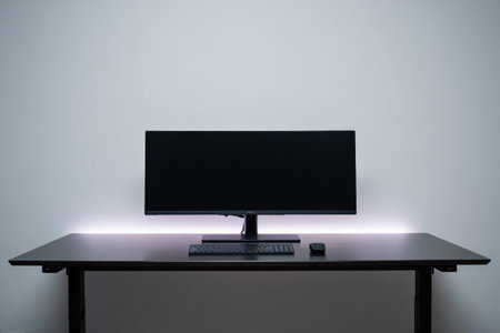 Modern workplace. Minimalist style. Black monitor, keyboard and mouse.の素材