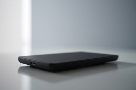 Black hard drive external isolated. Minimalist storage concept.の素材