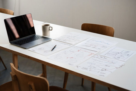 Brainstorming session. Project planning. Creative team collaboration. Laptop and sketches.の素材