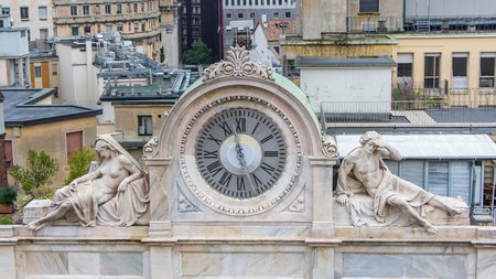 View on a historic clock from the roof of the dome of Milan