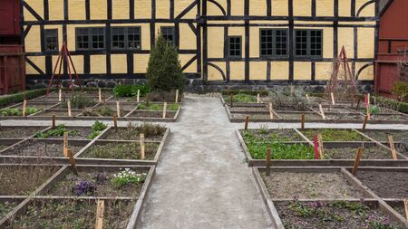 Old garden and half timered house in Open air museum Den Gamle By in Aarhus Denmarkのeditorial素材