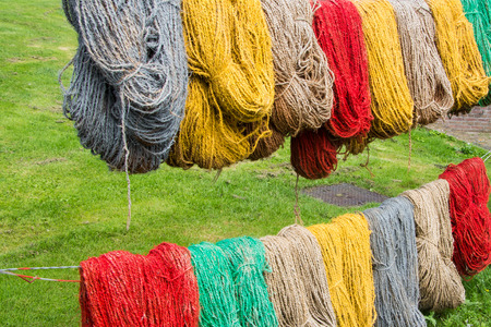 Colored carpet yarn drying at the Tapestry Museum in Genemuiden Hollandの写真素材