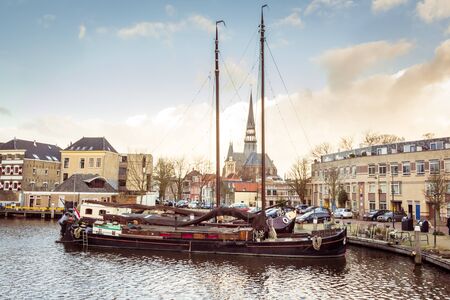 The old museum harbor of Gouda in the Netherlands with monumental ships from the beginning of 1900.