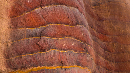 Beautiful stone colors in a cave in ancient Petra Jordanの写真素材
