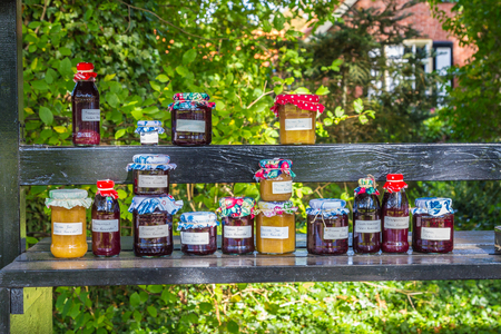 Market stall with home made jam in front of a houseのeditorial素材
