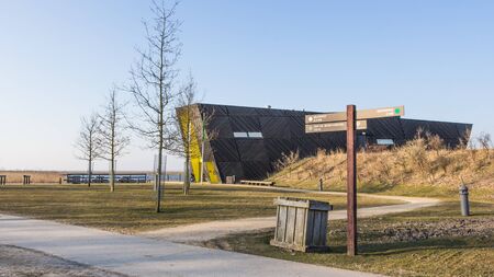 ALMERE, NETHERLANDS - MARCH 17, 2016: Visitor center Oostvaarders in NP Oostvaardersplassen, a large wild reserve with wetland and  large groups of konik horses and red deer.のeditorial素材