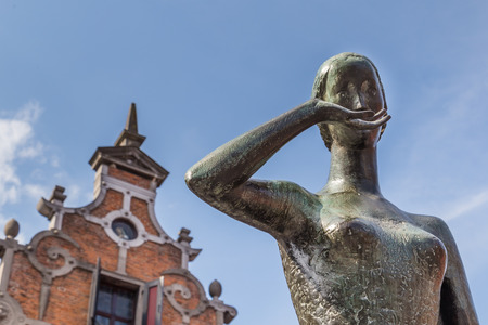 NIJMEGEN, NETHERLANDS - AUGUST 27, 2016:  Statue of Mariken van Nieumeghen at the central historic square with bars and restaurants in the ancient Dutch city center of Nijmegenのeditorial素材