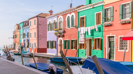 Venice, Italy - October 29, 2016: Tourists walking along the multi-colored houses and the canals on  the island Burano, Venice, Italyのeditorial素材