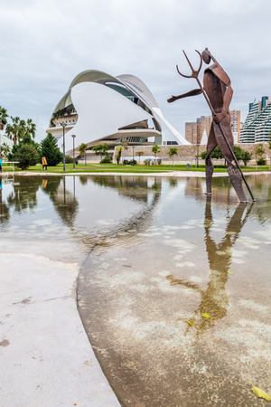 Sculpture of Neptune in Turia garden and Palau de les Arts in the city of arts and science Valencia, Spainのeditorial素材