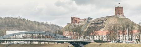Street view with Gediminas Tower on the hill of the old town center of Vilnius, Lithuaniaのeditorial素材